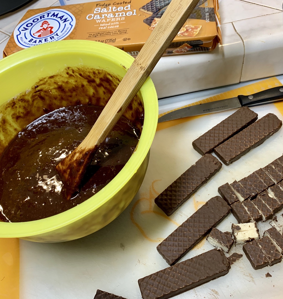 brownie batter with cut up wafers in bowl