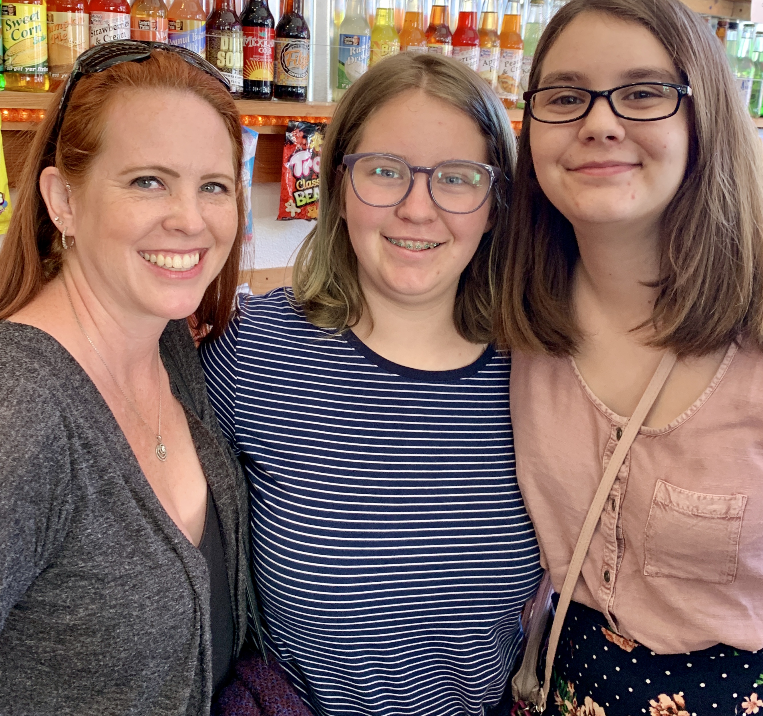 Mom and daughters in soda shop